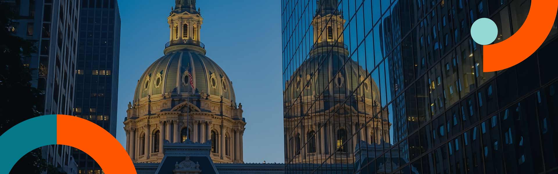 Domed state capitol building in a U.S. city skyline